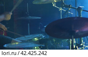 A detailed view of a drum set, including high-hats, snare drums, tom-toms, and cymbals, each contributing to the unique sound and rhythm of music. Стоковое фото, фотограф Воловодов Владимир / Фотобанк Лори