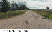 Forbidden Passage: Autumn Road through Nature's Canvas. Стоковое видео, видеограф Dzmitry Astapkovich / Фотобанк Лори