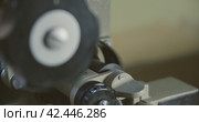 Close-up of a 35mm cine-film in movie projector. Стоковое видео, видеограф EStarodubov / Фотобанк Лори