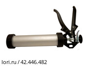 Ручной монтажный пистолет для клея на белом фоне. Silicone glue gun, isolated on white background. Стоковое фото, фотограф Татьяна Д / Фотобанк Лори