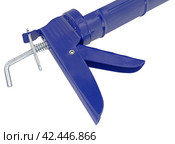 Ручной монтажный пистолет для клея на белом фоне. Silicone glue gun, isolated on white background. Стоковое фото, фотограф Татьяна Д / Фотобанк Лори