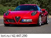 LINTHE, GERMANY - MAY 27, 2023: The sports car Alfa Romeo 4C. Die Oldtimer Show 2023. Редакционное фото, фотограф Sergey Kohl / Фотобанк Лори