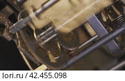 Internal clock mechanism. Working clockwork gears inside a old clock. Macro. Стоковое видео, видеограф EStarodubov / Фотобанк Лори