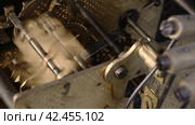 Internal old clock mechanism. Impact hammers watch driven by clockwork with audio. Macro. Стоковое видео, видеограф EStarodubov / Фотобанк Лори
