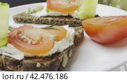 Sandwiches with cottage cheese and cucumber slices, cherry tomatoes on firewood. The concept of dietary nutrition. Стоковое видео, видеограф Ярославский Максим / Фотобанк Лори