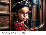 Close-up portrait of child girl in pirate image with reflection red eyeglasses posing in hold of ship at textured wall. Kid in pirates corsair costume. Theatre performance concept. Copy ad text space. Стоковое AI-изображение, AI-художник Aleksandr Golubev / Фотобанк Лори