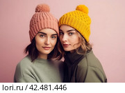 Women winter hats colorful. Generate AI. Стоковое AI-изображение, AI-художник Иван Рябоконь / Фотобанк Лори