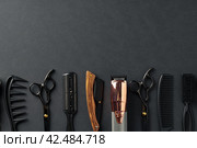 An Assortment of Professional Hairdressing Tools Laid Out on a Dark Surface. Стоковое фото, фотограф Сергей Толмачёв / Фотобанк Лори