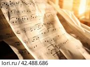 Music sheets in the shadow closeup. Generate Ai. Стоковое AI-изображение, AI-художник Иван Рябоконь / Фотобанк Лори