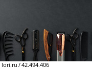 An Assortment of Professional Hairdressing Tools Laid Out on a Dark Surface. Стоковое фото, фотограф Сергей Толмачёв / Фотобанк Лори