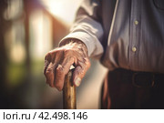 Elderly male hand on walking stick. Generate ai. Стоковое AI-изображение, AI-художник Иван Рябоконь / Фотобанк Лори