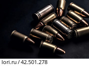 Bullets on dark background. Generate ai. Стоковое AI-изображение, AI-художник Иван Рябоконь / Фотобанк Лори