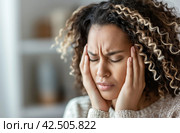 Woman with severe headache. Стоковое AI-изображение, AI-художник Данил Руденко / Фотобанк Лори