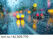 Raindrops on a windowpane with blurred city lights in the background. Стоковое AI-изображение, AI-художник Юрий Поздников / Фотобанк Лори