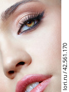 Closeup macro shot of human female face. Woman with eyes and lips beauty makeup. Стоковое фото, фотограф Сергей Пристяжнюк (Serg Zastavkin) / Фотобанк Лори