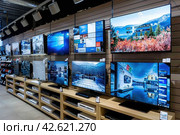 Explore a Diverse Selection of Cutting-Edge Televisions at Our State-of-the-Art Electronics Store. Стоковое AI-изображение, AI-художник Юрий Поздников / Фотобанк Лори