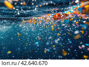 Colorful microplastic particles in sea water, environmental pollution concept. Стоковое AI-изображение, AI-художник Евгений Харитонов / Фотобанк Лори