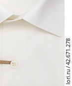 Button placket on an ivory dress shirt, close-up. Стоковое фото, фотограф Сергей Чайко / Фотобанк Лори
