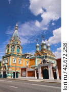 The orange colour orthodox church of St. Gregory of Neocaesarea in Darbitz in Moscow in Russia. Стоковое фото, фотограф Darja Belikova / Фотобанк Лори