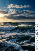 Atmospheric scenery Dramatic Baltic sea, waves and water splashes on breakwaters. Nature north cloudscape on coast ocean. Environment with fickle weather, climate change. Stormy, abstract backgrounds. Стоковое AI-изображение, AI-художник Aleksandr Golubev / Фотобанк Лори