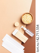 Depilation, epilation, hair removal tools on beige-brown background. Стоковое фото, фотограф Юлия Трикашная / Фотобанк Лори