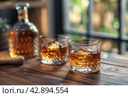 Two glasses and bottle of whiskey on a wooden table, Стоковое AI-изображение, AI-художник Анна Кривицкая / Фотобанк Лори