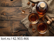 Two glasses and bottle of whiskey on a wooden table, Стоковое AI-изображение, AI-художник Анна Кривицкая / Фотобанк Лори