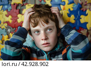 A child with autism spectrum disorders (ASD) such as Asperger's, Rhett and Heller. Стоковое AI-изображение, AI-художник Ирина Ручушкина / Фотобанк Лори