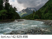 View of the Psysh River and the Amanauz-Bashi Mountain of the Northern Caucasus Mountains near the village of Arkhyz on a sunny summer day, Karachay-Cherkessia, Russia. Стоковое фото, фотограф Ula Ulachka / Фотобанк Лори