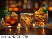 Strong alcohol drinks, hard liquors, spirits and distillates set in glasses and bottles: cognac, scotch, whiskey and other. Black bar counter background. Стоковое AI-изображение, AI-художник Ирина Михайличенко / Фотобанк Лори