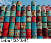 Stacked Colorful Industrial Barrels. Стоковое AI-изображение, AI-художник Кирилл Черезов / Фотобанк Лори