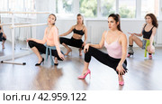 Female instructor performing graceful sass dance at group class. Стоковое фото, фотограф Яков Филимонов / Фотобанк Лори
