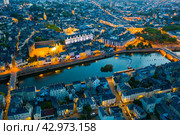 Evening aerial view of Laval with buildings, river Mayenne and old bridge. Стоковое фото, фотограф Яков Филимонов / Фотобанк Лори