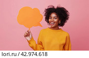 Woman with magenta hair smiling, holding orange speech bubble in fun gesture. Стоковое AI-изображение, AI-художник Юрий Поздников / Фотобанк Лори