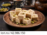 Plate piece halva. Generate Ai. Стоковое AI-изображение, AI-художник Иван Рябоконь / Фотобанк Лори
