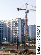 Belarus, Minsk - 07 february, 2024: Modern houses in Minsk world. Редакционное фото, фотограф Аксенова Вера / Фотобанк Лори