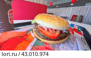 Moscow April 10 2024, Double Whopper Burger. King/Fast food restaurant and self-service checkouts. Burger on a tray in fast food restaurant close-up. Редакционное фото, фотограф Скрипачев Антон / Фотобанк Лори