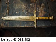 Mysterious Ancient relic sword gold. Generate Ai. Стоковое AI-изображение, AI-художник Иван Рябоконь / Фотобанк Лори
