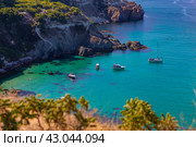 Bounty Beach Vinogradnaya Bay Cape Fiolent in Sevastopol An ideal place for travel and summer holidays Boats and yachts in crystal clear emerald water (2023 год). Редакционное фото, фотограф Светлана Евтушенко / Фотобанк Лори