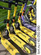 Moscow, Russia - Apr 26. 2024. Short-term rental service for electric scooters Yandex Go and Urent in Zelenograd. Редакционное фото, фотограф Володина Ольга / Фотобанк Лори