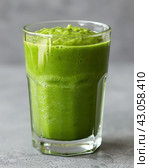 A plantbased drink with AOJIRU in a glass on a table. Стоковое AI-изображение, AI-художник Юрий Поздников / Фотобанк Лори