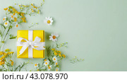 Spring Gift Box with Yellow Wrap and White Bow on Pastel Green Background, ai-generated item. Стоковое AI-изображение, AI-художник Юлия Паутова / Фотобанк Лори