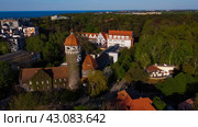 Svetlogorsk, Russia - May 1, 2024: Water tower Rauschen top ariel view. Редакционное фото, фотограф Наталья Симакова / Фотобанк Лори