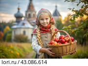 The concept of the Russian Orthodox holiday yablochny spas. A beautiful little girl in Russian national clothes and a headscarf with a basket of red ripe apples on the background of an Orthodox church. Стоковое AI-изображение, AI-художник Photojuli / Фотобанк Лори