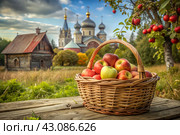 The concept of the Russian Orthodox holiday yablochny spas. A beautiful wicker basket made of vines with red ripe apples on the background of an Orthodox church. Стоковое AI-изображение, AI-художник Photojuli / Фотобанк Лори