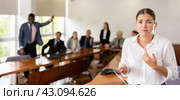 Devastated millennial white brunette female worker being fired. Стоковое фото, фотограф Яков Филимонов / Фотобанк Лори
