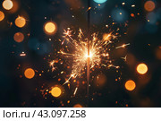 New Year's sparkler at night against a bokeh background. New Year and Christmas concept. Sylvester, New Year's party 2025. New Year. Fireworks. Holiday card with fireworks - sparklers and bokeh. Стоковое AI-изображение, AI-художник Евгений Демидюк / Фотобанк Лори