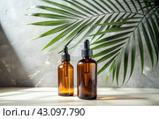 Aromatherapy. A glass bottle with a pipette for oil, lotion and palm leaves on a concrete background. Natural organic eco-cosmetics. The layout of the corporate identity of the beauty salon. Стоковое AI-изображение, AI-художник Photojuli / Фотобанк Лори