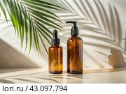 Aromatherapy. A glass bottle with a pipette for oil, lotion and palm leaves on a concrete background. Natural organic eco-cosmetics. The layout of the corporate identity of the beauty salon. Стоковое AI-изображение, AI-художник Photojuli / Фотобанк Лори