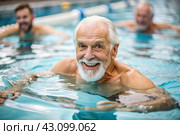 An elderly man swims and does water aerobics in a heated pool, a happy and smiling pensioner. Recreational water sports. Стоковое AI-изображение, AI-художник Photojuli / Фотобанк Лори